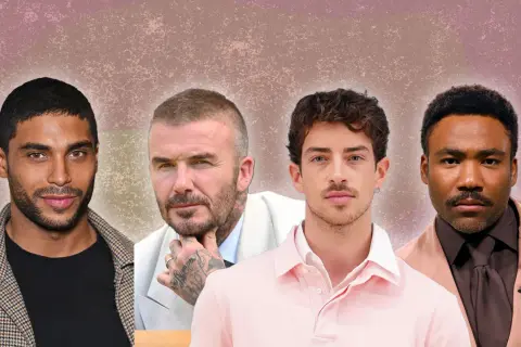 Quatre hommes stylés, chacun avec une coupe homme classe courte, posent pour un portrait.